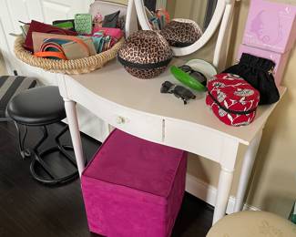 painted wood vanity desk with mirror; basket of wallets (Tory Burch, Coach, and more), storage cube and Kate Spade sunglasses