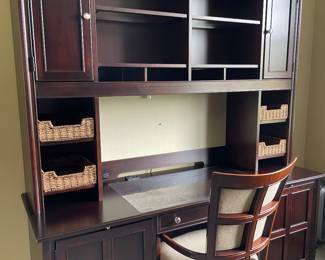 desk with hutch and storage basket and shown with wood and upholstered armchair