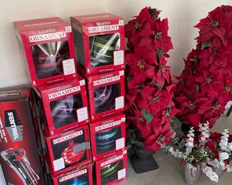 Holiday ornaments and poinsettia topiaries