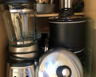 Assorted cookware including a Cuisinart blender