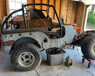 Jeep CJ was dismantled to refurbish. All original parts are there along with a new Holley engine block.