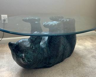 Glass top coffee table with plaster bear base
