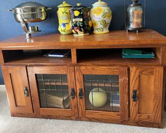 Oak entertainment console with glass doors