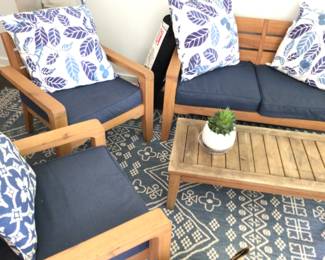 Teak 4 piece outdoor set. Seating was kept inside table outside. With cushions and pillows $385
