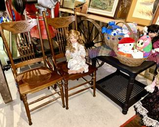 Antique chairs with leather seat inserts, collectible dolls, painted black side table with glass top, Squishmallows, etc.