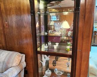  Sliding front, lighted curio cabinet