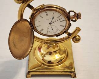 Elgin pocket watch on brass stand