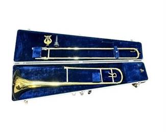 Lot 839   
Vintage Vincent Bach Corp Brass Trombone with Case