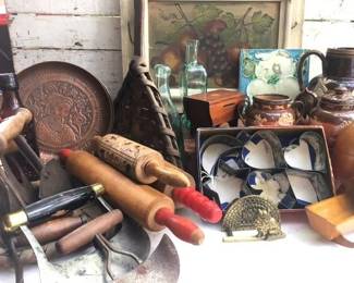 Unpacking more old kitchen ware of all kinds...rolling pins, cookie cutters, tinware, utensils and much more