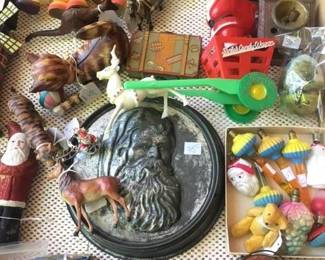 At least 9 tables and showcases FULL of antique and collectible holiday items, cast iron and tin toys