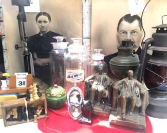 Abe Lincoln bookends, pharmacy apothecary bottles and oil lamps 