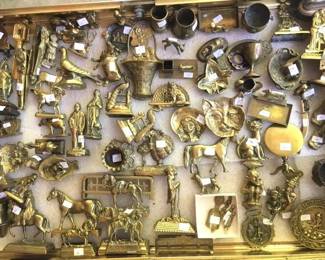 Antique brass door stops, figurines, match holders, aninals...just a small sampling of what is available