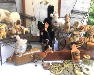 We found 1 whole box of antique Steiff animals...this is only a sampling.  The wire doll buggy is soooo cute.
