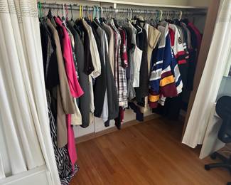 Assorted men's and women's clothing, including hockey jerseys. Sizes LG, and XLT(men)