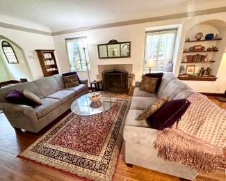 Gorgeous living room filled with treasures and nice furniture.