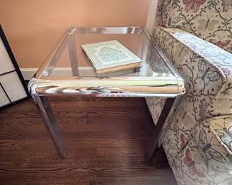 Pair of two vintage chrome and glass end tables.