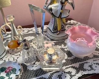 Perfume bottles, Fenton bowl and antique figural lamp.