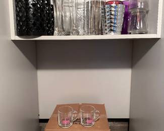 Basement pantry filled with kitchenware and odds and ends.