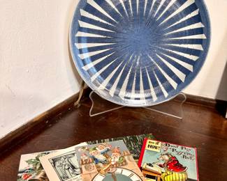 Large pottery plate and vintage postcards.