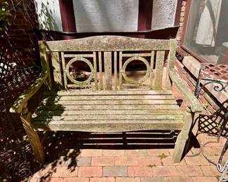 One of three teak garden benches.