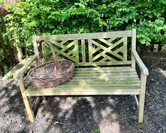 One of three teak outdoor benches.