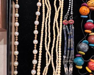 Necklaces collected while traveling.