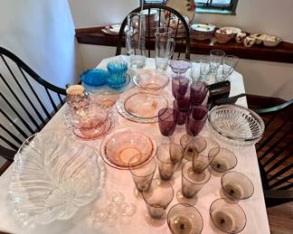 Table full of vintage glassware.