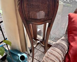 Antique wicker and wood plant stand with copper insert.