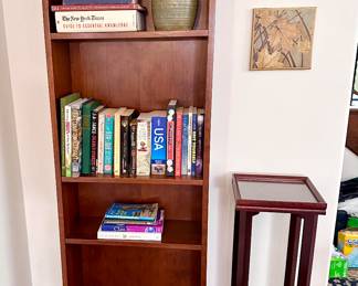 One of two narrow bookcases.