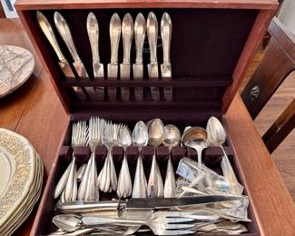 Two sets of silver plate flatware.