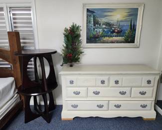 white dresser and two bedside tables