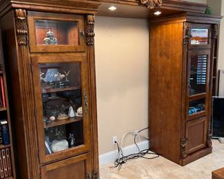 $295. Ea. $500. Set.  Adjustable 3 piece wall unit.  The two side cabinets measure 28” wide 24” deep x 6’9” tall and can be used as stand allowance be cabinets .  The removable and adjustable lighted crown lays across the two cabinets and stands 7’9” highest point.  This crown piece measures is 6’6” long by 29” deep, the applied medallion is 11” tall.  