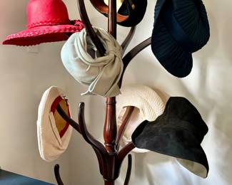 19th century hat rack with super cool collection of hats fromt he 40's and 50's 
