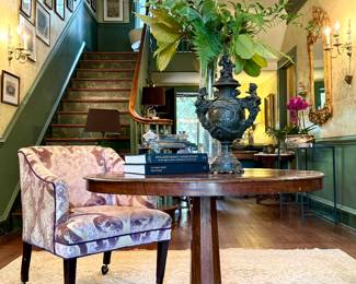 Antique entry table, custom club chair, like new rugs, antique bronze urn and gilt mirrors to die for