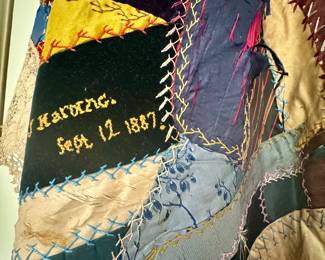 Old crazy quilt made in 1887