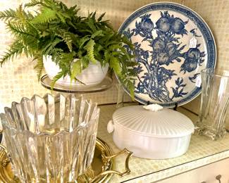 crystal, cabinets of white serving pieces, brass trays
