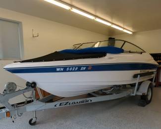  001 Reinell 180 Power Boat with EZ Loader Trailer, Suzuki 115 Motor, Bimini Top, and Boat Cover.