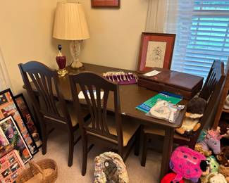 Dining room table and 2 sets of silverware (both plated)