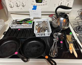 Cast iron pans, Kitchen utensils, and tea pots
