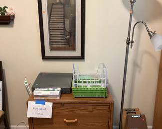 Printer table, floor lamps, electronic typewriter, and artwork