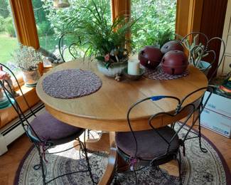 Round wood table with ice cream chairs