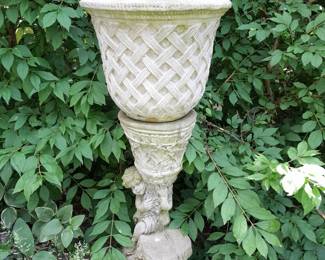 Several concrete urns of various types