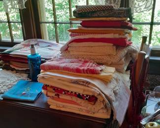 Lots of tablecloths and placemats and linen napkins