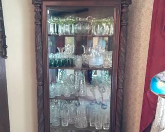 Glass doored cabinet filled with glassware