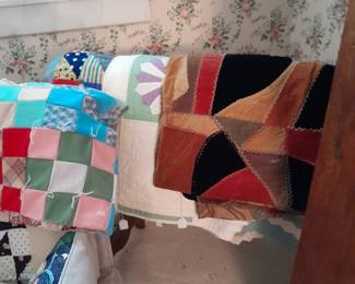 Lots of hand stitched quilts