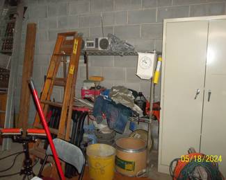 the metal cabinet has hand/power tools