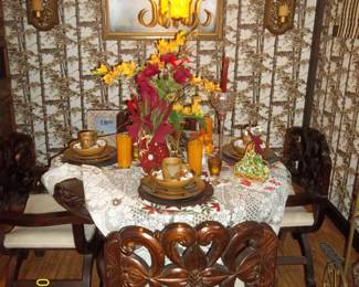 lovely table that has hand carved magnolias. was purchased just above the Mexican border in southern Texas and shipped here.  There is another picture without the table cloth.