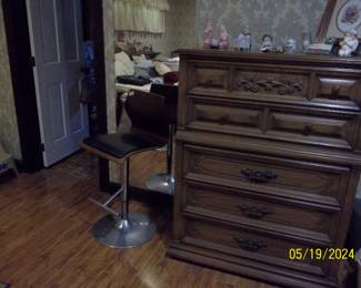 chest of drawers that is part of the king bed set