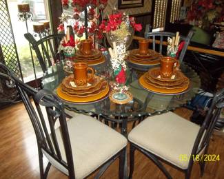 the other iron table, beautifully decorated, notice the scalloped edges of the glass top