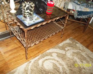 and another iron ornamental table